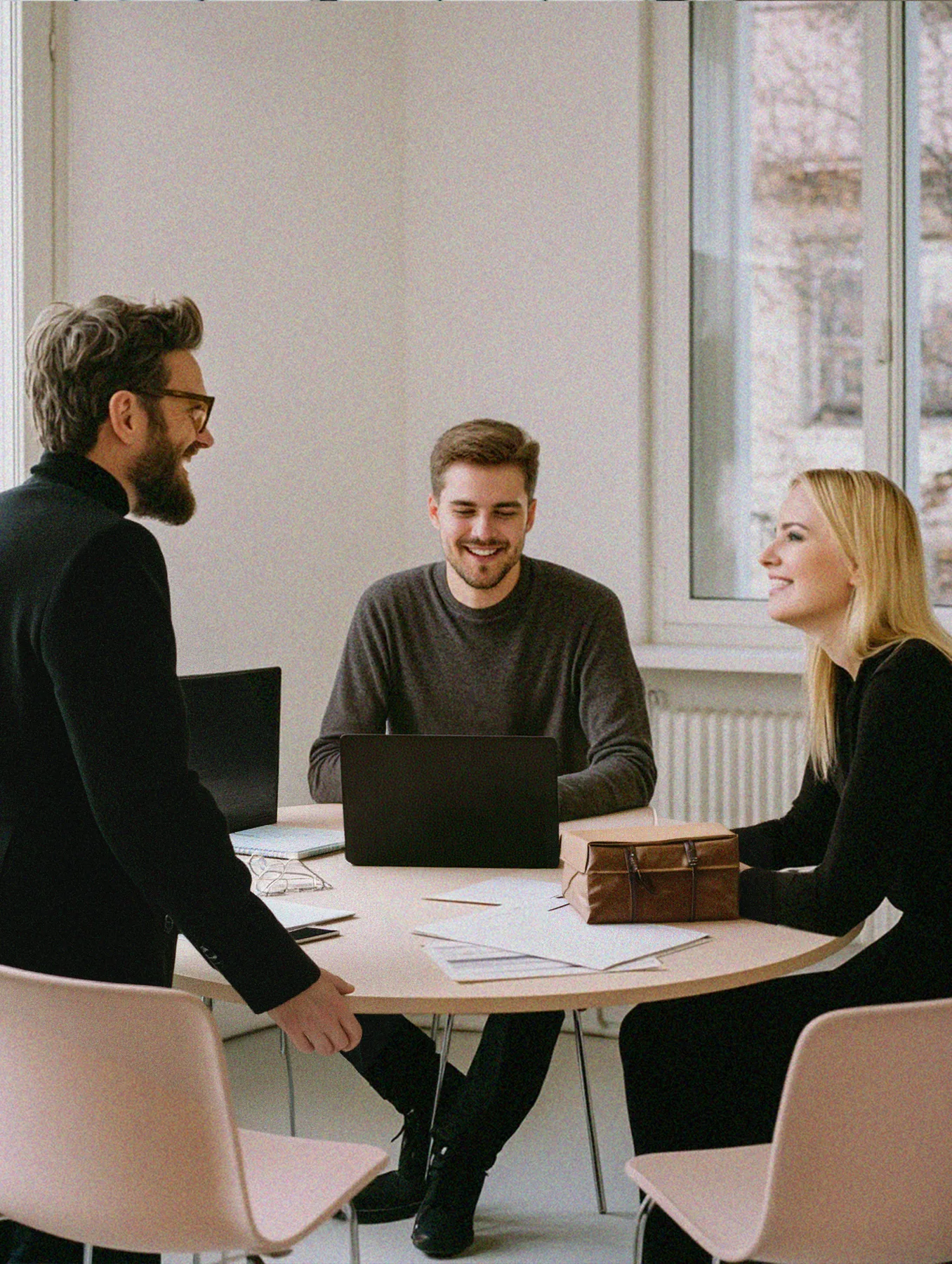 A revenue team laughing together after a win