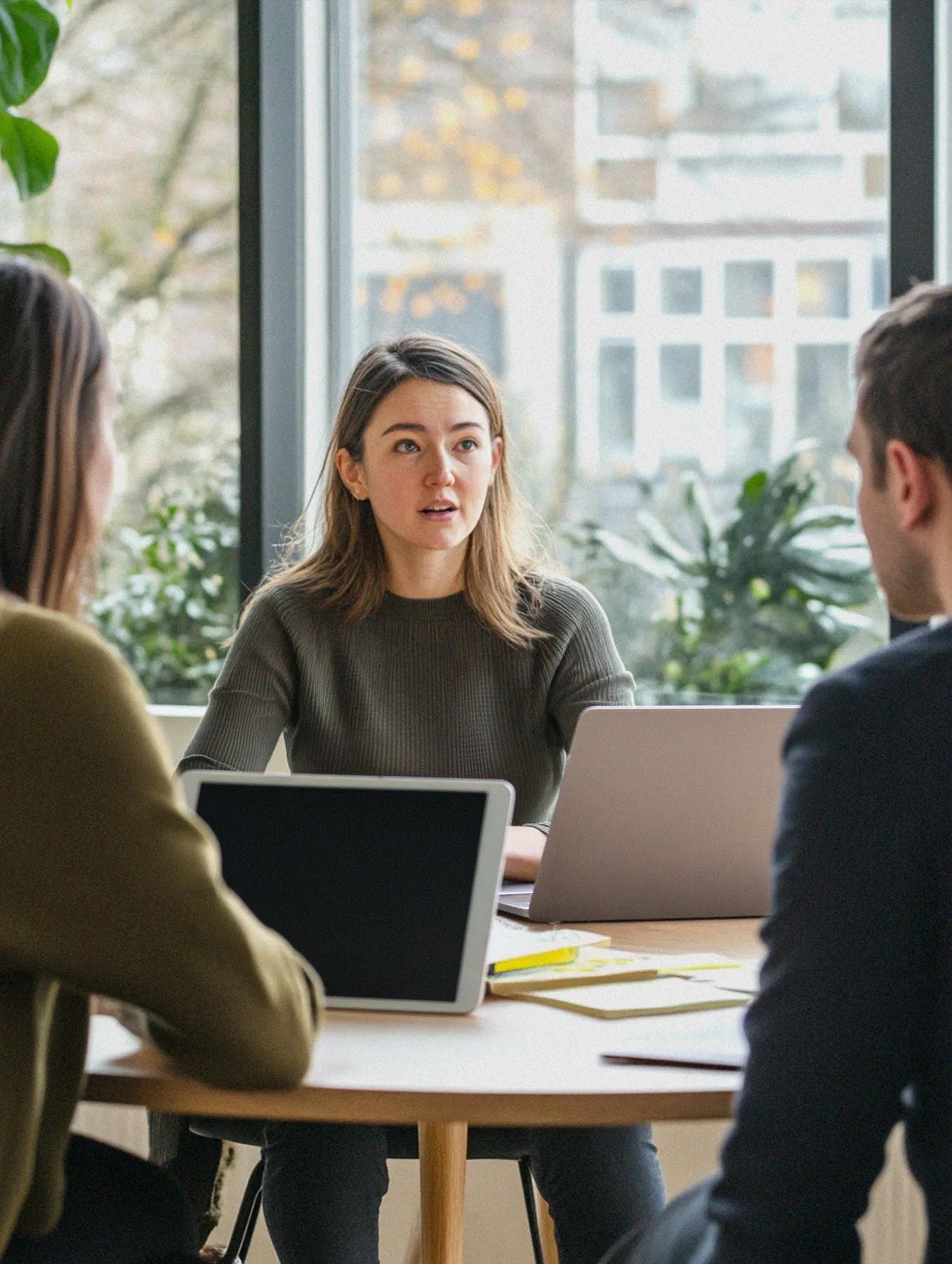 A team in a working session by a window