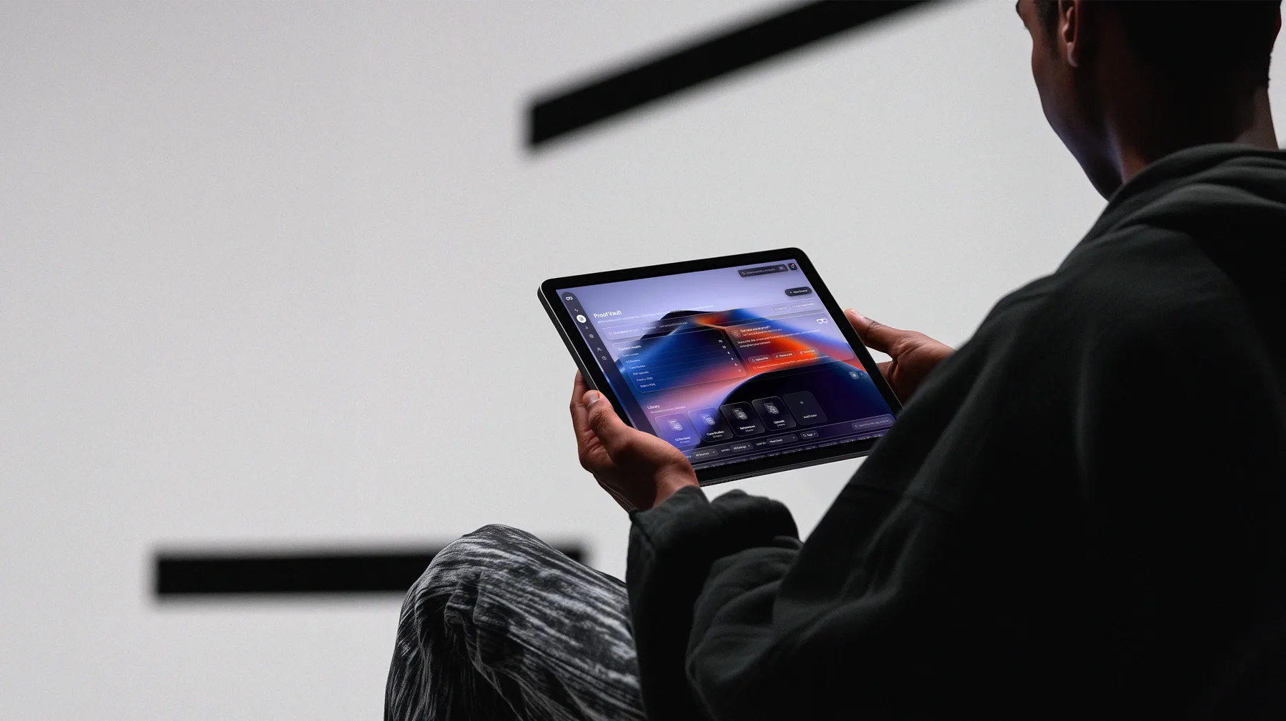 A revenue leader reviewing Carly's ProofVault on a tablet — the proof library, ready to deploy.
